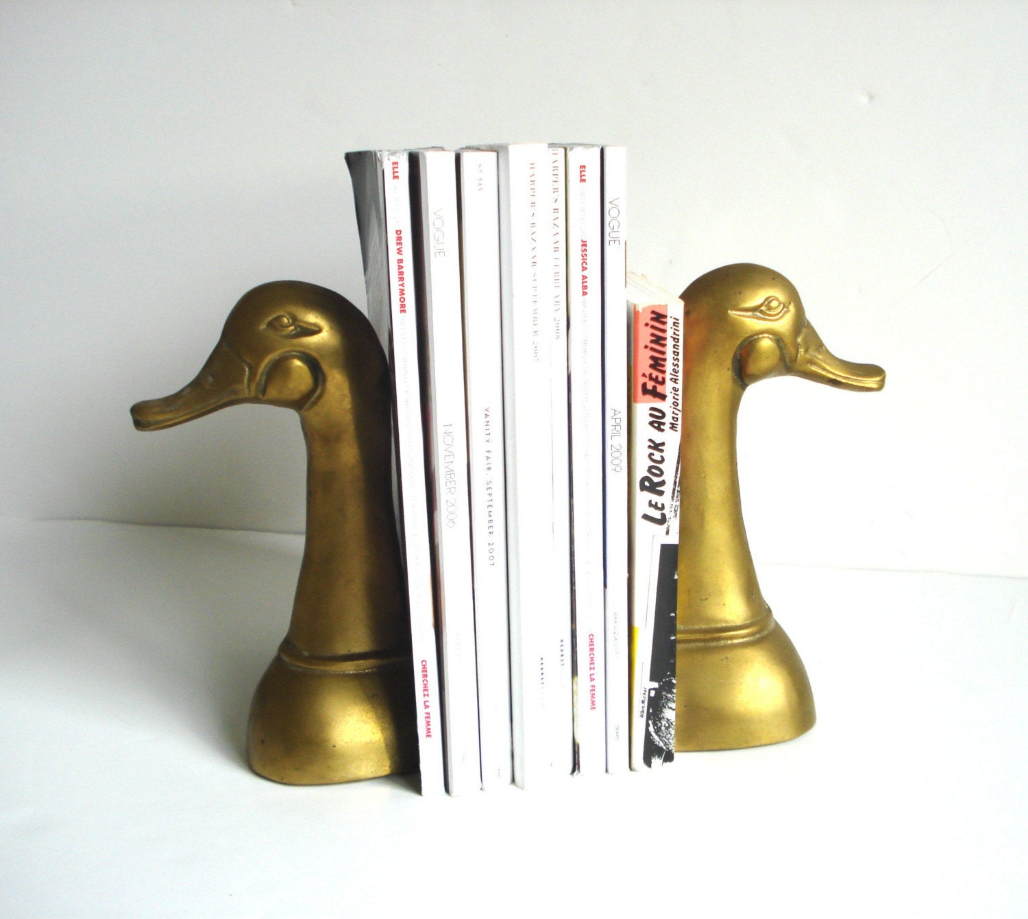 brass bookends marked with t