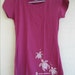 Maui-designed, hand-embellished, plum preshrunk, French cut ladies-tee with Swarovski crystals