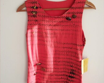 Orange screenprinted tank tee with wooden buttons