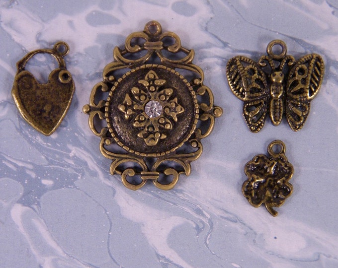 Set of Antique Brass Metal Charms- Four Leaf Clover, Locket, Butterfly, Medallion