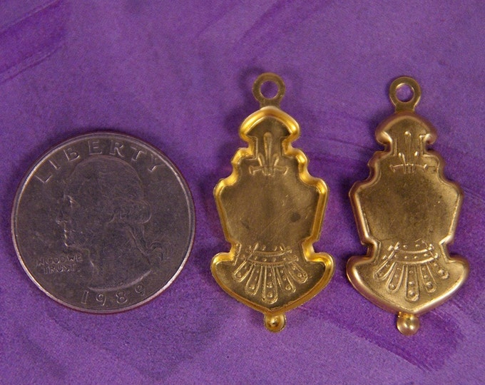 Pair of Brass Crest-like Shield Charms