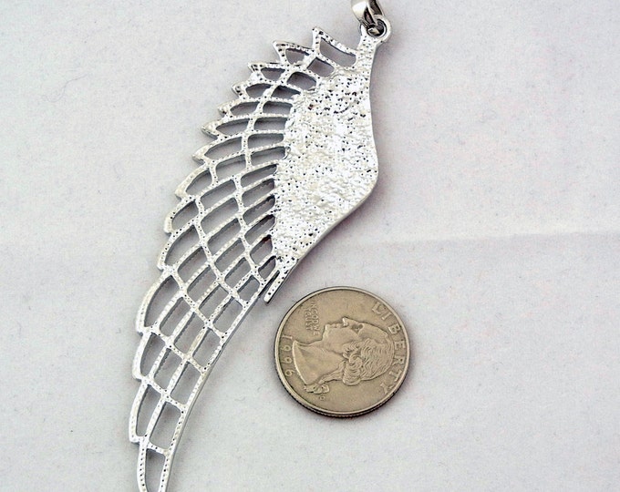 Large Silver-tone Cut-out Wing Pendant with Siam Red Rhinestone