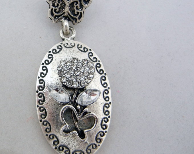 Antique Silver-tone Floral and Butterfly Theme Pendant with Rhinestone Accents