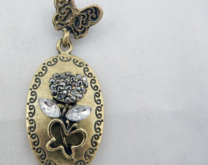 Antique Gold-tone Floral and Butterfly Theme Pendant with Rhinestone Accents