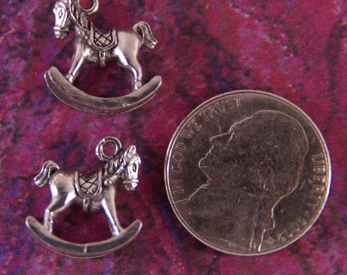 Pair of Pewter Rocking Horses