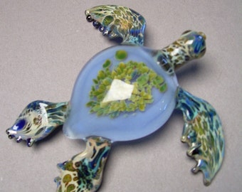 Sculptured Glass Sea Turtle paperweight swimming under the ocean with Anemone seaturtle shell