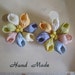 Dainty shell craft screw post earrings hand made on original Shells from the Seven Seas card