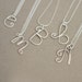 R E S E R V E D .............initial. letter. yours. custom sterling silver wire NECKLACE.