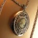 Victorian style vintage 70s silvertone metal necklace with cameo locket pendant.