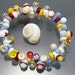 Melanie Moertel Lampwork Beads - Red, yellow, blue and white bracelet, elastic, with 47 handmade glass beads - "Elements"