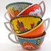 5 Tin Toy Tea cups in yellow, blue & orange litho, Instant Collection.