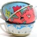 40s Tin Toy Tea Cups & Saucers, Set of 6 with bunny, birds and flowers.