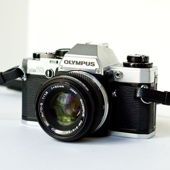 1980s Olympus OM10 35mm SLR camera with 50mm f1.8 lens and