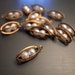10 vintage raw brass ellipse shape caged beads charm with white pearl bead inside