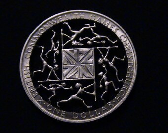 1974 New Zealand - cut coin pendant - w/ Athletes from the Commonwealth Games