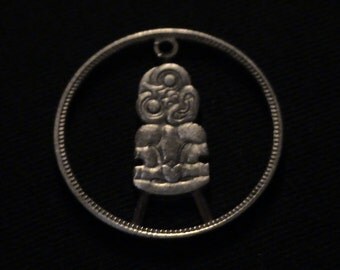 1963 New Zealand - cut coin pendant - w/ Hei Tiki