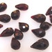 Pack of ten Garnet briolette beads, 5x9mm each average 028-05-003