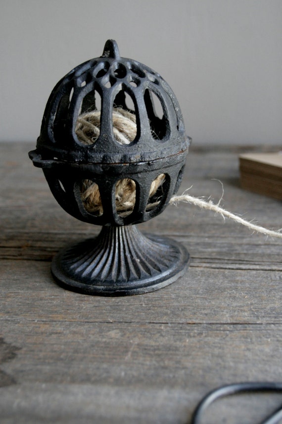 antique cast iron string holder
