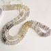 Tour Of Rutilated Quartz Moss Amethyst Black And Golden Stripey Gemstone Sparkling ROndelle Beads 1/2 Strand