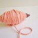 Blush thick cotton twine on a chocolate spindle