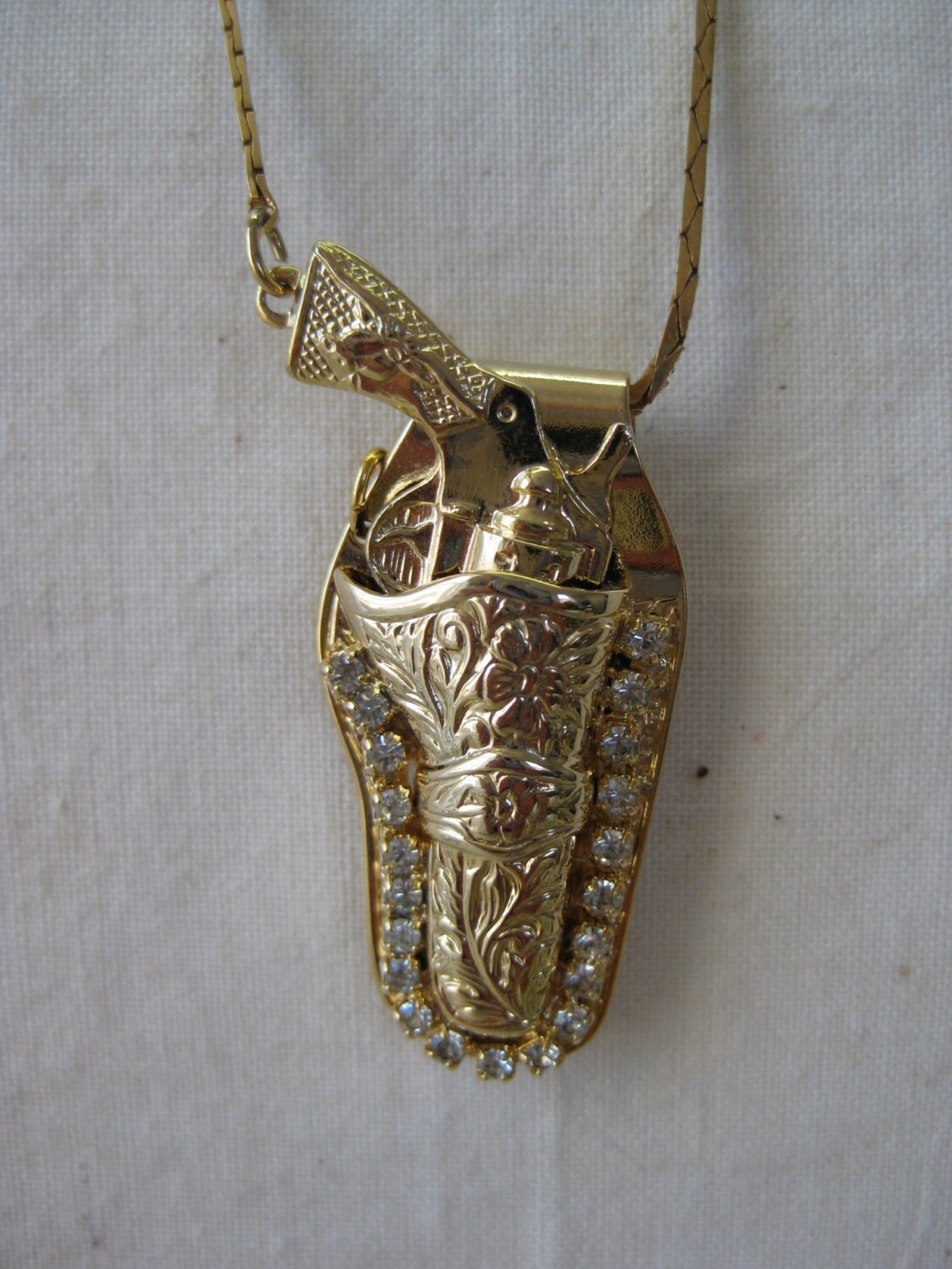 Golden Gun in Holster with Sparkle necklace