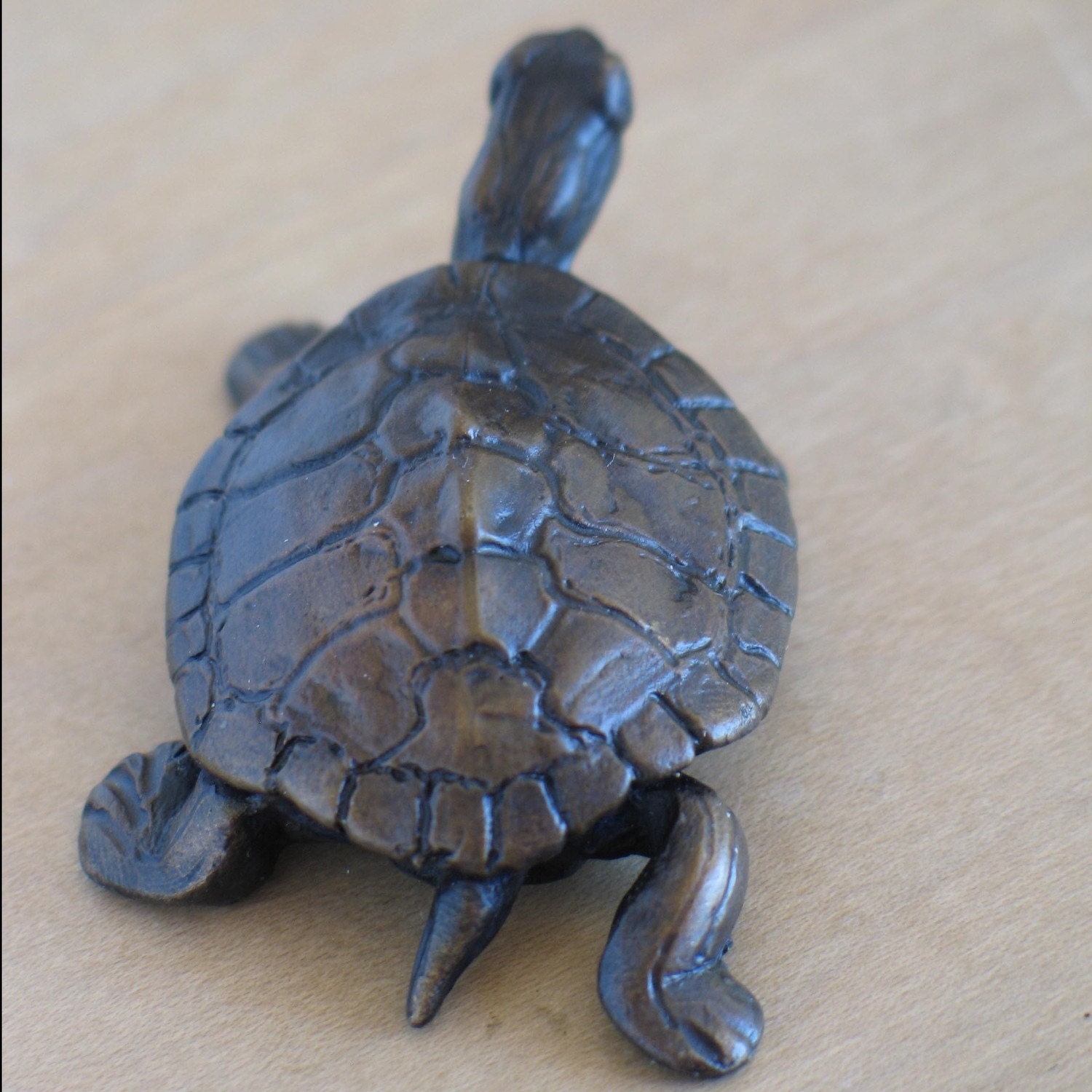 Tiny bronze turtle sculpture