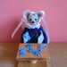 Felt Mouse Doing a Puzzle