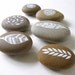 as seen in homes and gardens magazine . collection of six handpainted beach pebbles . nature set 8 . by natasha newton