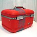 red train case with turquoise tree