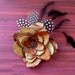 KORA - Flower and Feathers with a vintage button