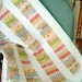 Stacked Coins Floral Baby Quilt