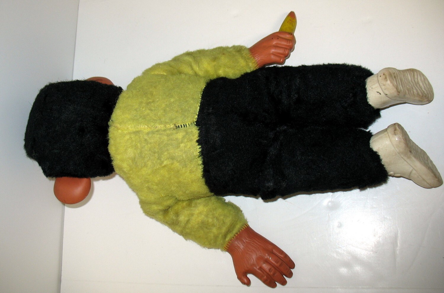 old monkey doll with banana