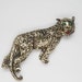 Vintage Cat Brooch Figural Jaguar with Green Rhinestone Eyes scrollwork metal tin offered by Tootsystreasures on Etsy