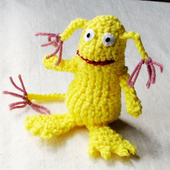 Whimsical monster crocheted in bright lemon yellow with dusty