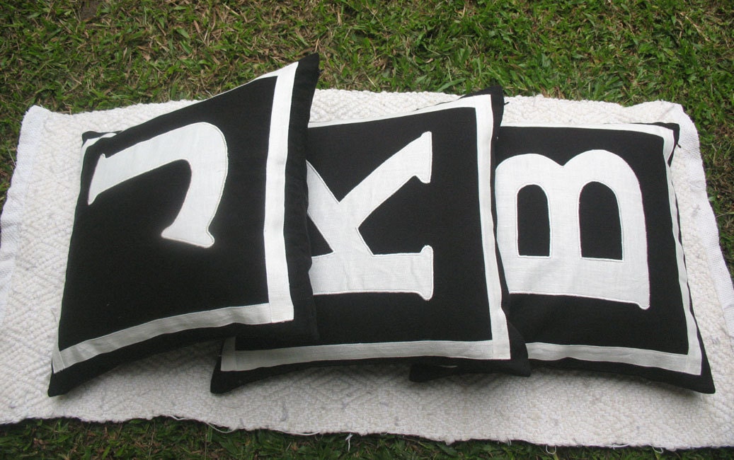 Black and white initial pillow. Decorative letter pillow
