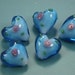 Lot of 5 gorgeous beautiful large handworked blue glass heart beads with roses on and hole from the top to bottom
