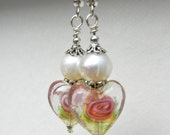 Pearls and glass heart earrings.