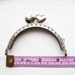8.5cm/3.3 inch Silver purse frame with heart shaped snap head, sew holes, and single loop