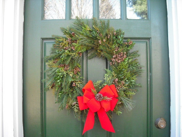 Fresh assorted evergreen wreath. 18" size, made with Pine, Balsam, Boxwood, and cedar. With red velvet bow.