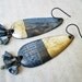 The Orphaned Mind. Asymmetrical Found Object Dangles with Decoupage and Gold Foil.