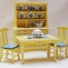 Dollhouse miniature cupboard, table and chairs in yellow with tiny flowers in ultramarine blue and white