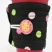 Cup cozy, black with green and pink dots