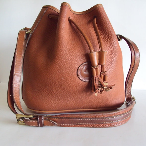 Vintage Dooney And Bourke Drawstring Shoulder Bag by pascalvintage