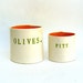 olives and pits  ....  hand built porcelain containers ...  vessels