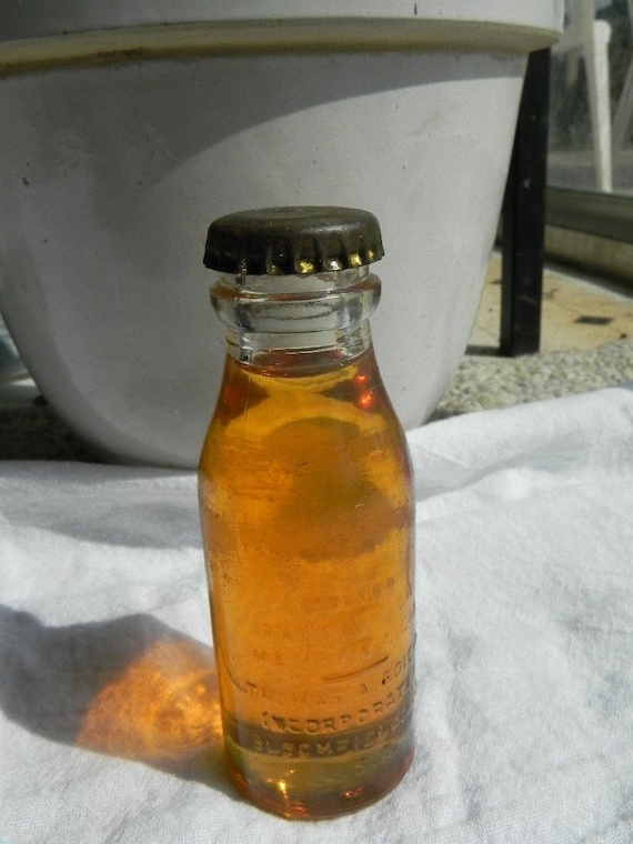 Vintage Thomas Edison Battery Oil bottle full with cap