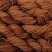 400 yards of pure wool yarn, worsted weight, hand dyed copper, 4 skeins, 7 oz.