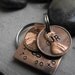 Lucky Us Copper Keychain with two lucky pennies The squared version