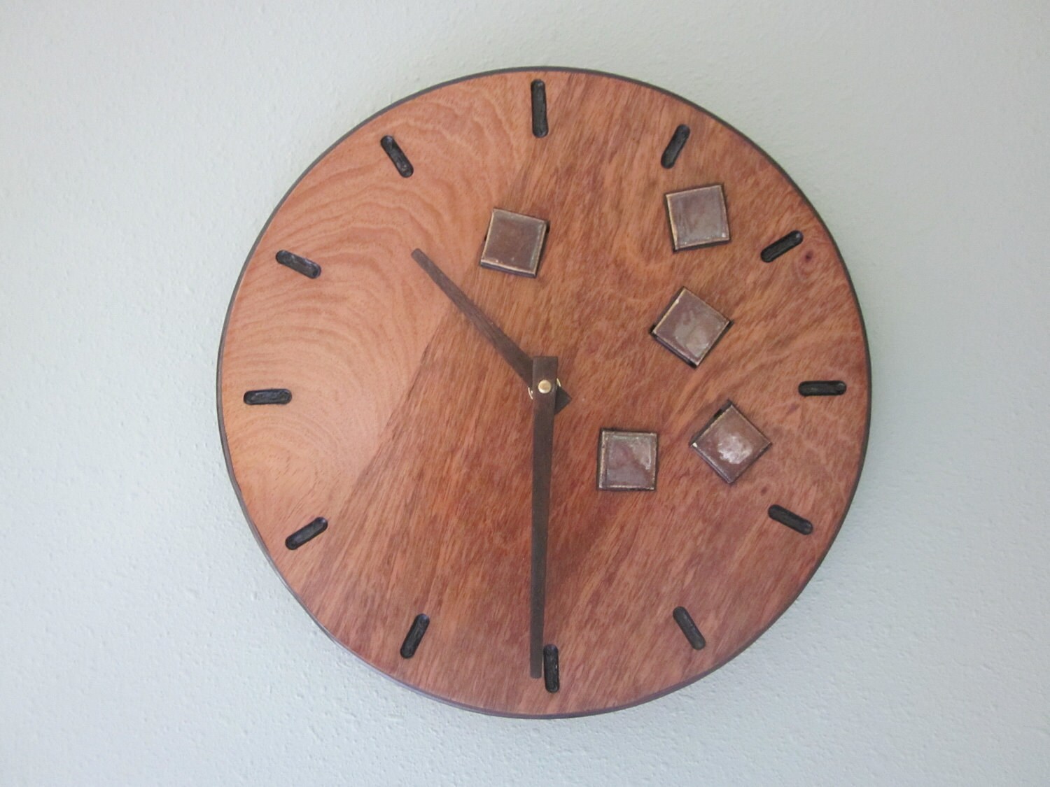 Cherry wood wall clock with brown mosaic tiles by