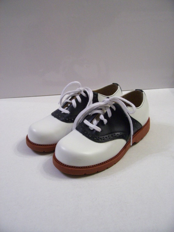 Items similar to Vintage Youth Navy and White Saddle Shoes 11 on Etsy