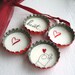 SALE- Hand Holding Red Heart- Up-Cycled Bottle Cap Magnets with Red Organza Bag- Set of 4- Recycled and Eco-friendly